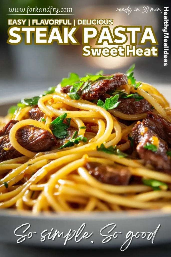 Sweet and spicy garlic steak pasta portioned into glass meal prep containers with herbs on top.