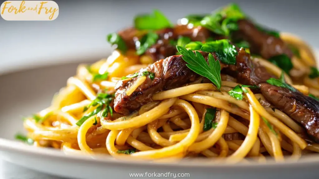 Sweet and spicy garlic chicken pasta with soy glaze, plated with fresh herbs.
