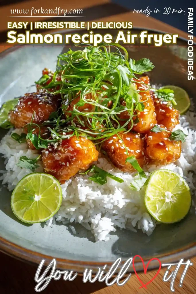 crispy air fryer salmon bites with sesame glaze over white rice, garnished with lime and herbs