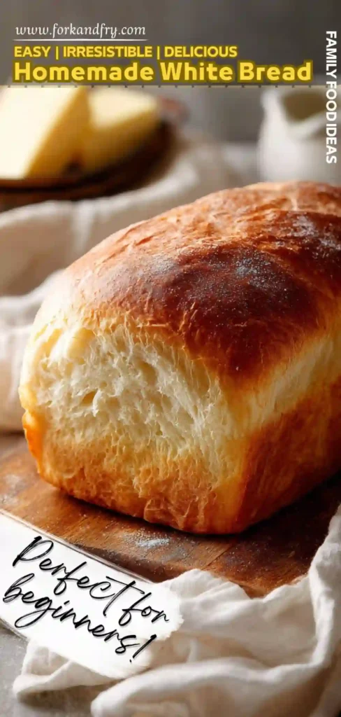 Easy Homemade White Bread Recipe for Beginners tall loaf of fluffy homemade white bread with golden top on a wooden board