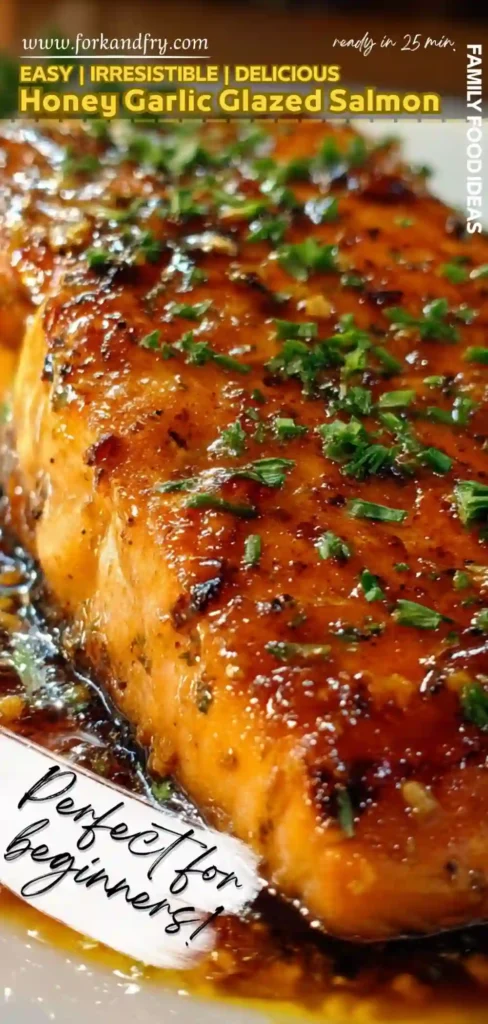 close up vertical image of honey garlic glazed salmon fillet topped with herbs